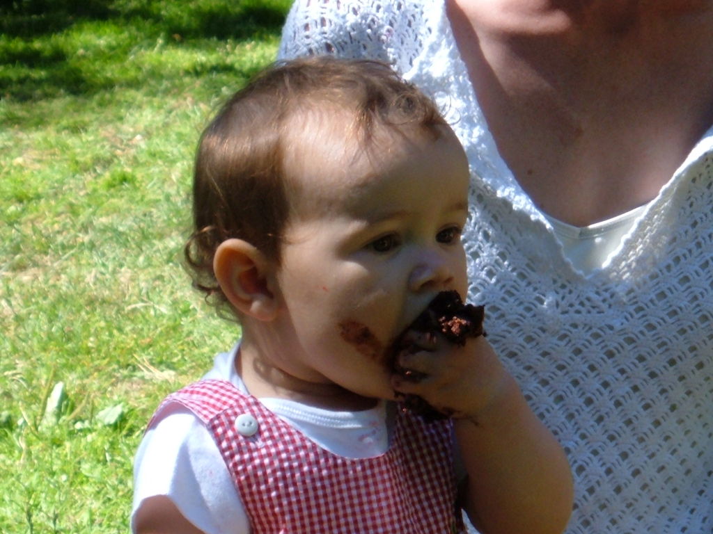 Margot eating cake - 1st birthday party