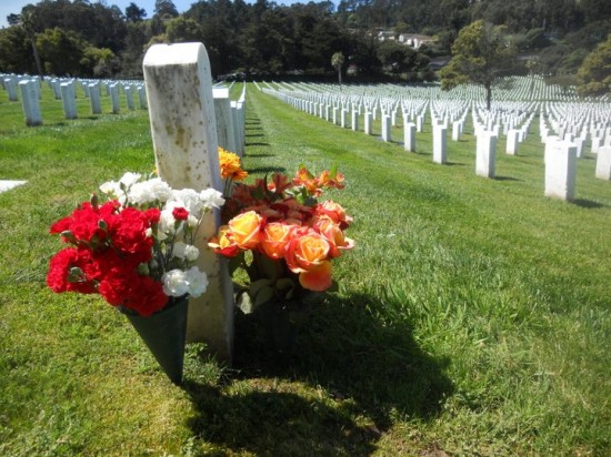 WW2 cemetery memorial day headstone with flowers