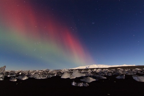 red and green northern lights Iceland