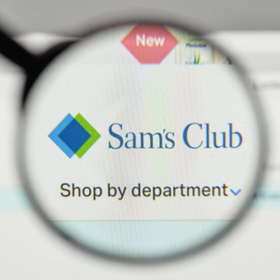 Magnifying glass over the Sam's Club website.