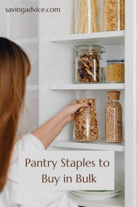 Woman arranging glass jars in her pantry