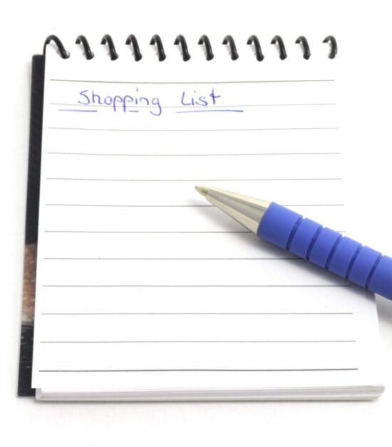 Pad of paper with "shopping list" written at the top