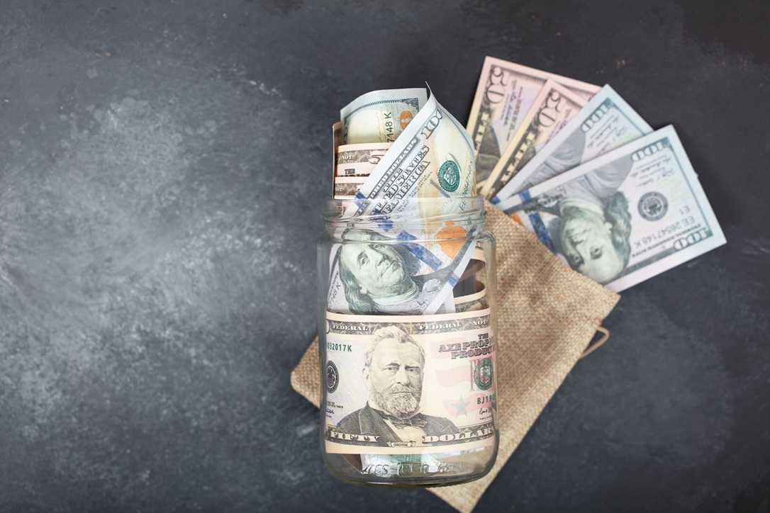 Glass jar full of money