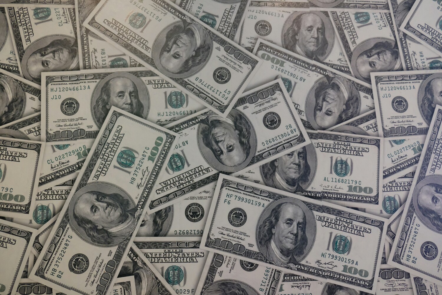 pile of 100 dollar bills