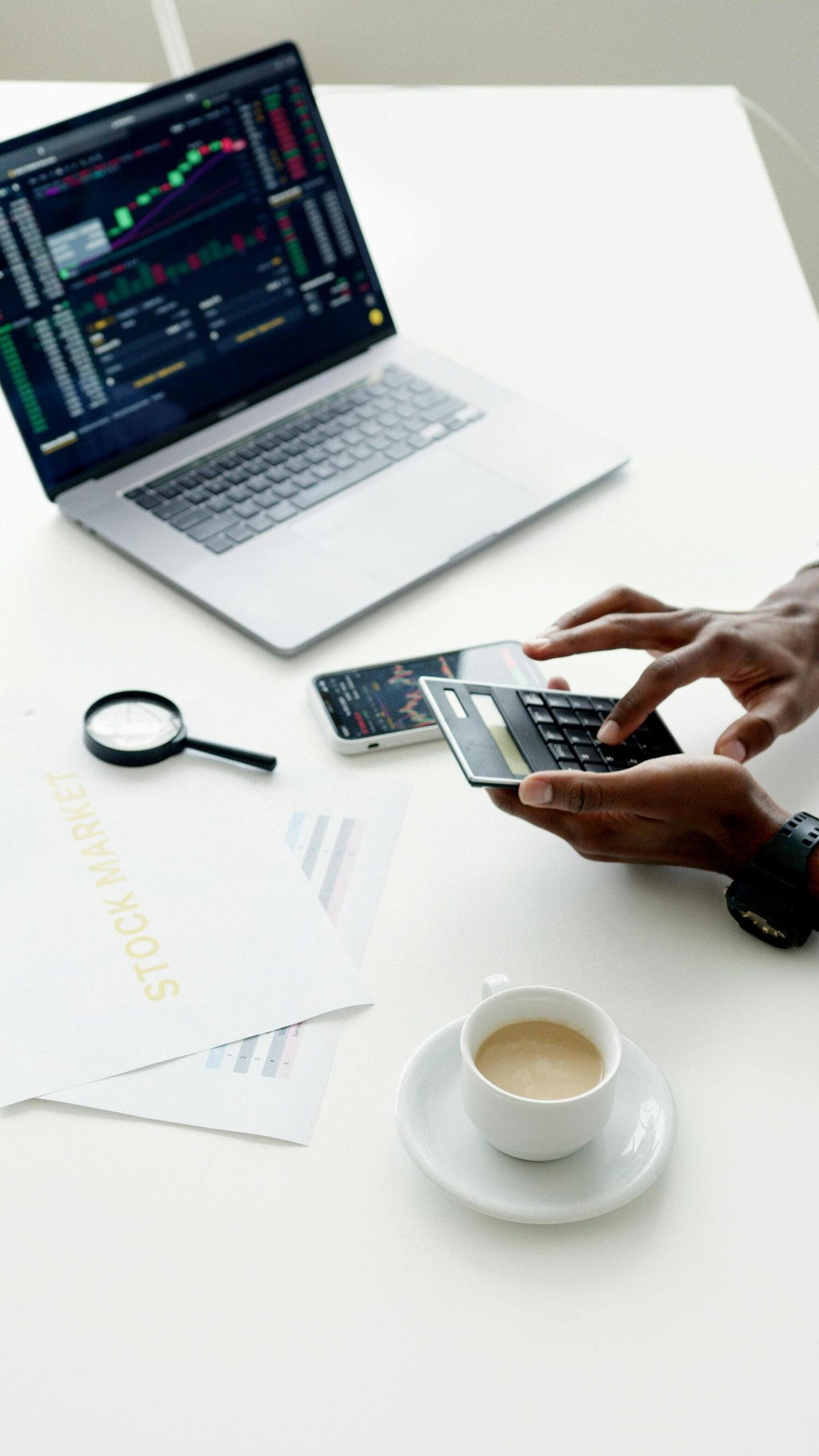 computer looking at stocks, calculating stocks