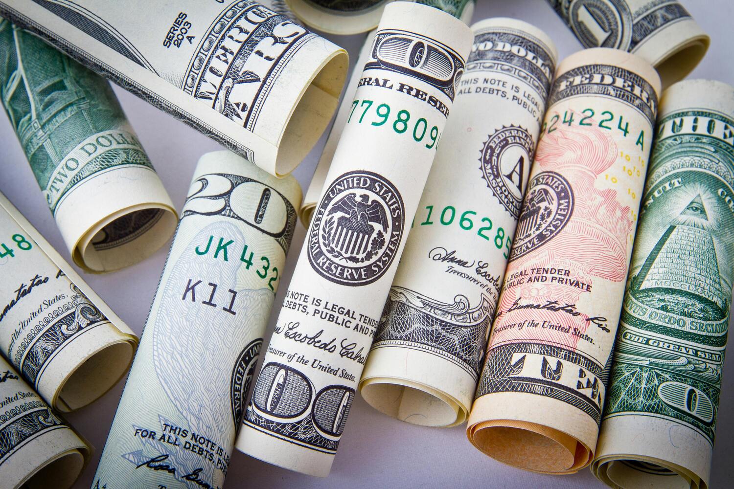rolled up dollars, dollar bills, cash