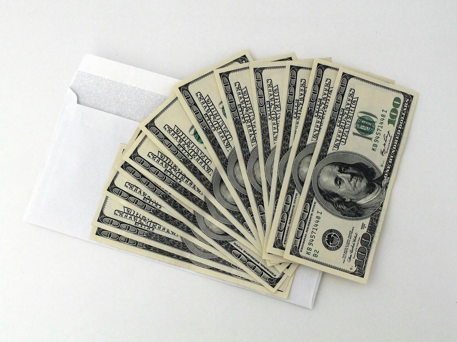 envelope full of hundred dollar bills