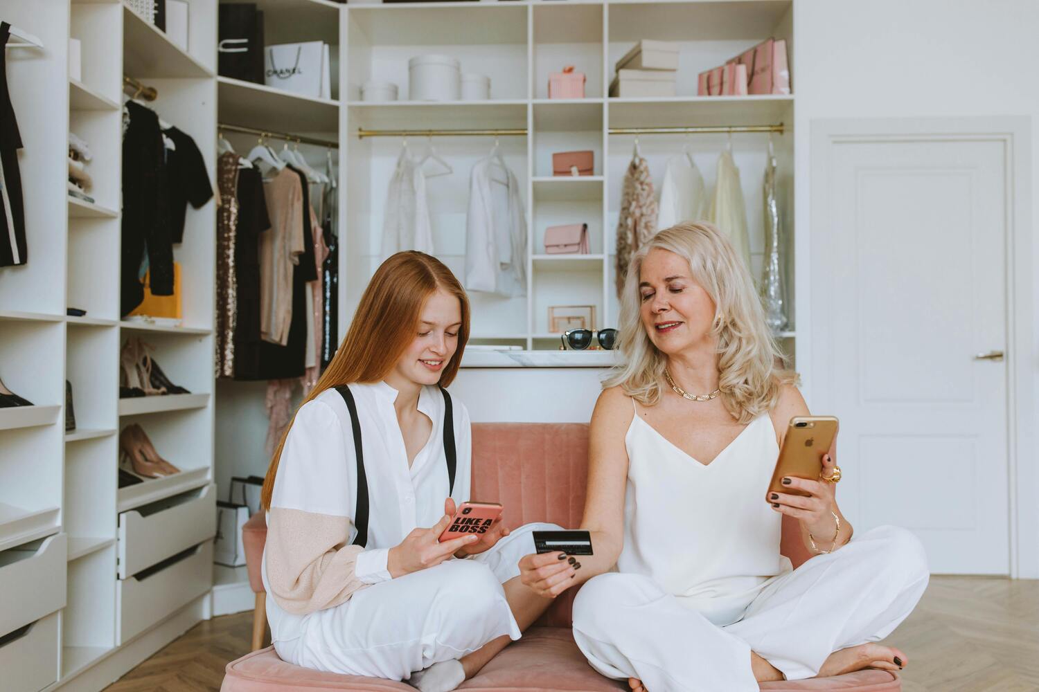 mom and daughter sitting in closet