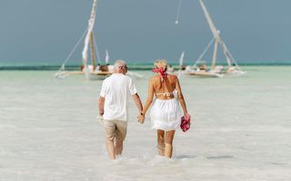 retirement couple on the beach