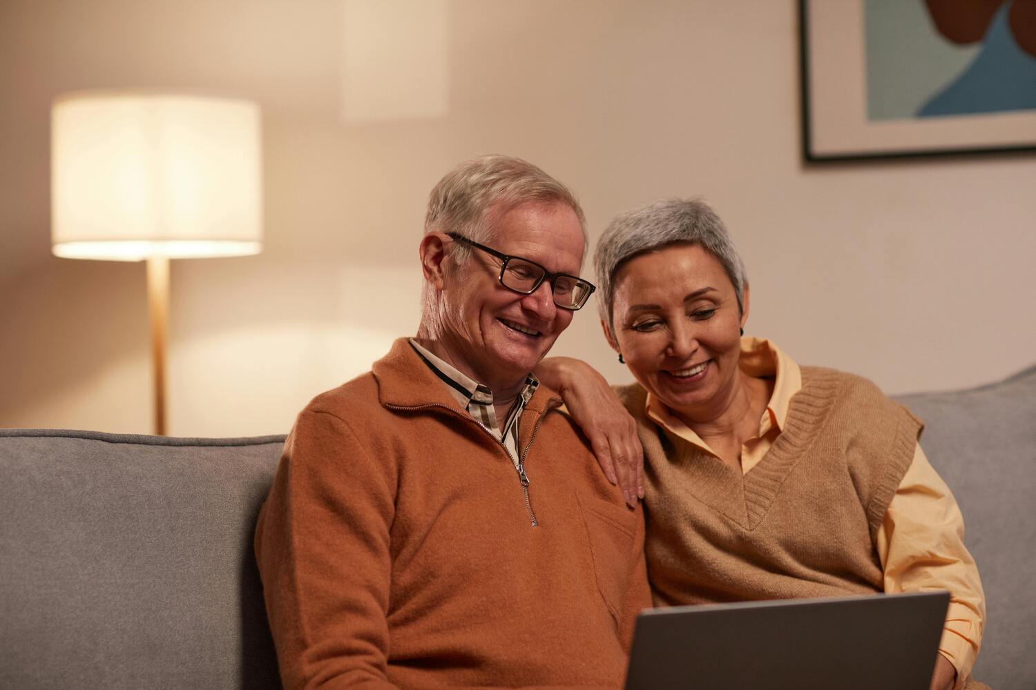 elderly couple sitting on the couch
