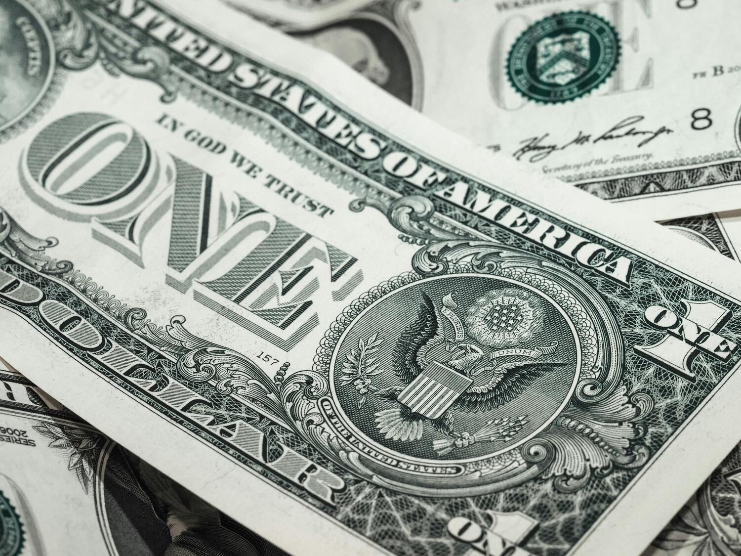 dollar bills, stack of money, stack of dollars
