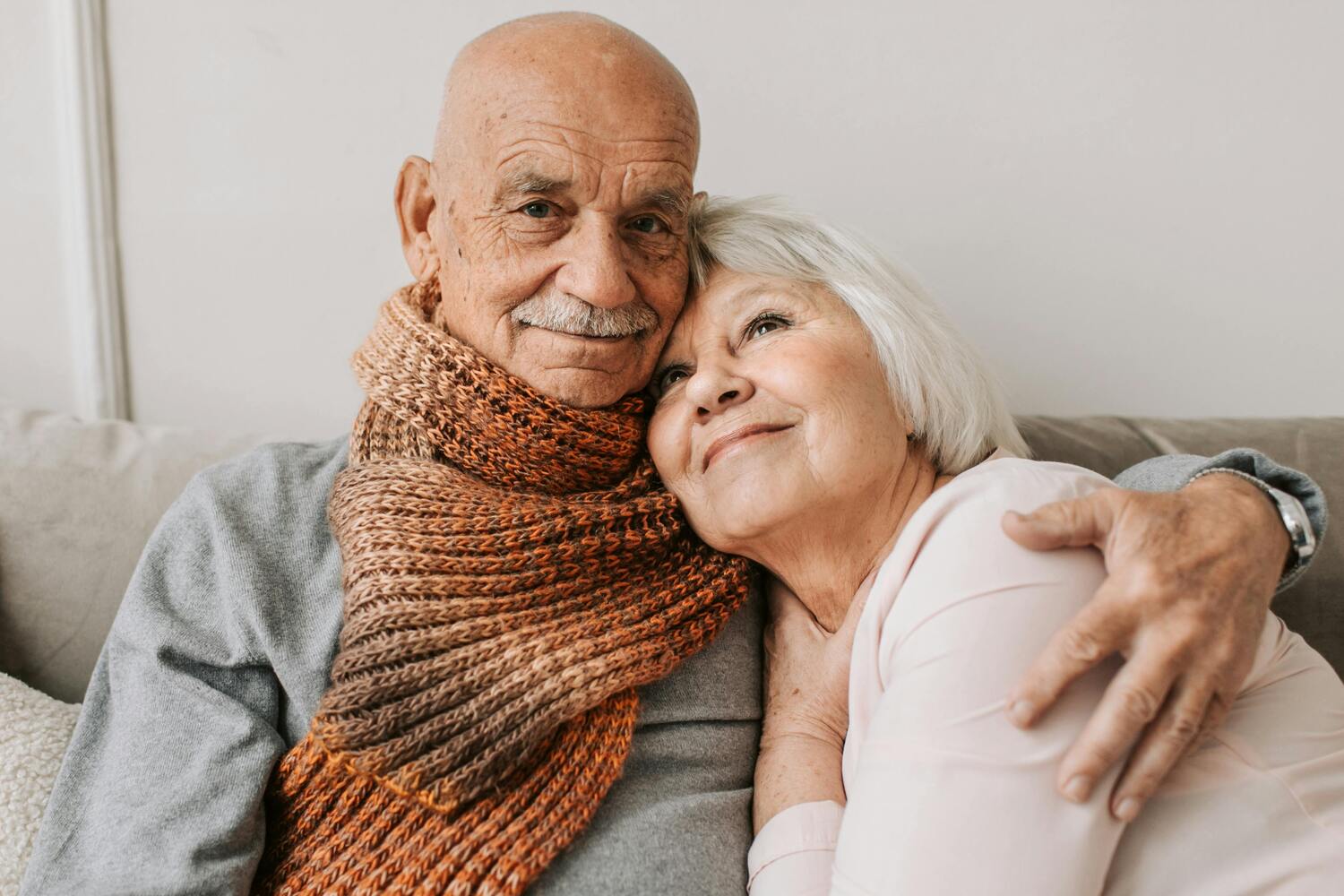 older couple cuddling on the couch