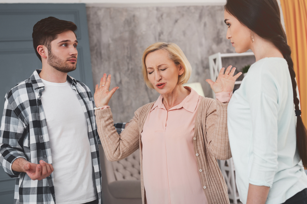 mother trying to prevent children from fighting over will