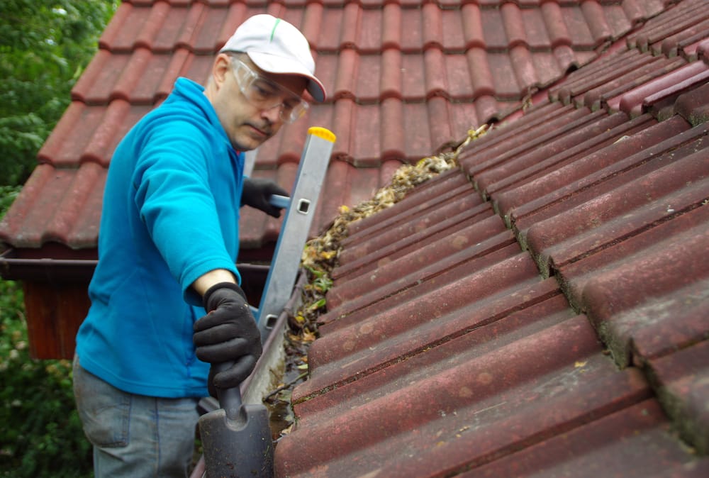 freezing-weather home fixes cleaning gutters