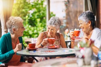 Women enjoying coffee and a lively conversation.
