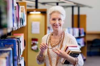 senior utilizing library card