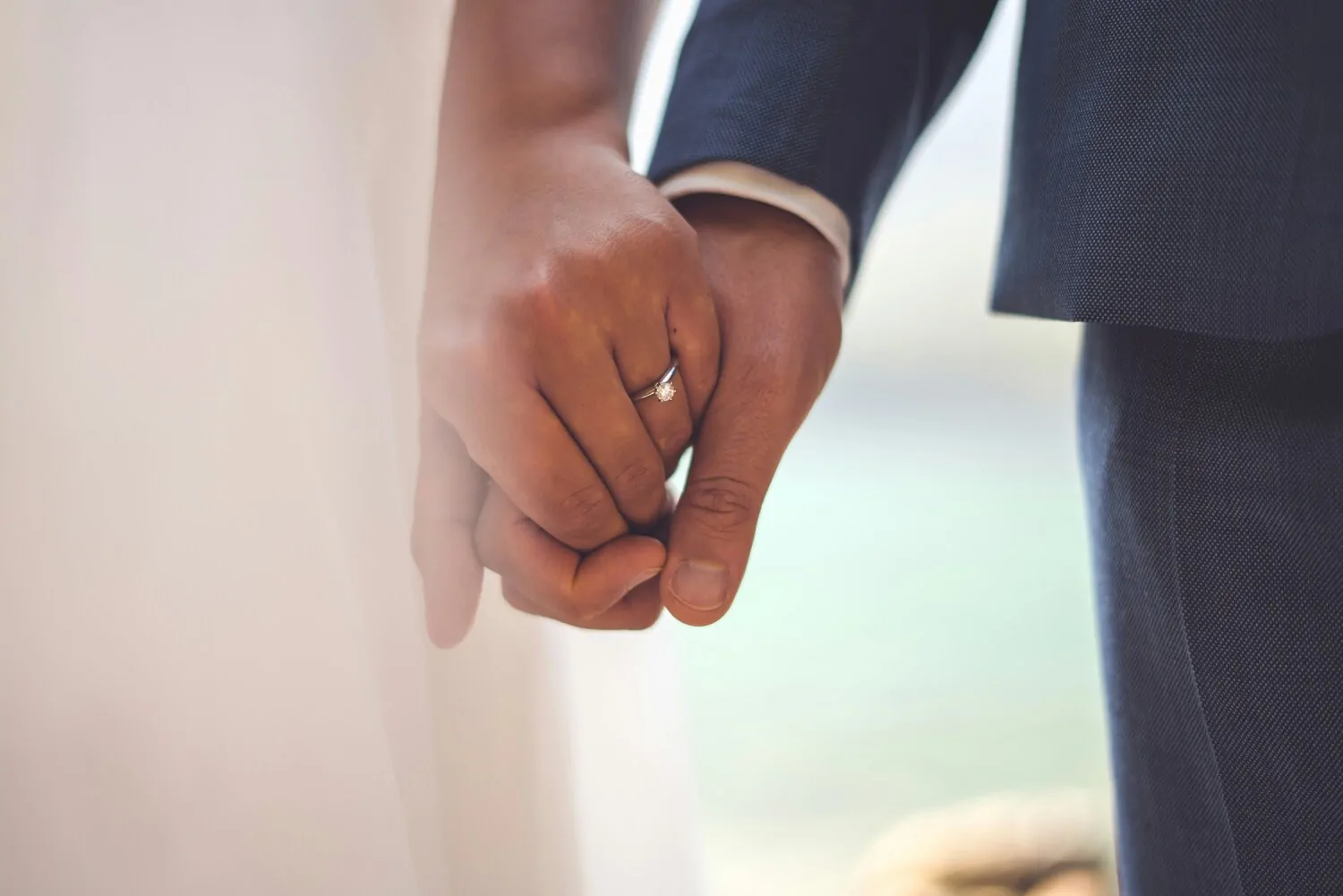 wedding couple holding hands, newlyweds holding hands